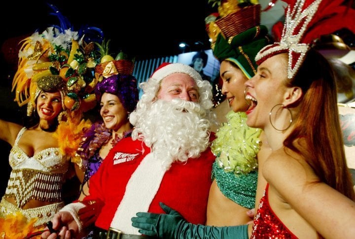 Santa Claus poses with Samba dancers outside one of the biggest shopping malls in Hong Kong. ©Reuters/Bobby Yip