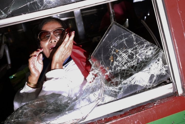 A frightened woman in a bus during clashes between protesters and police.  ©Reuters