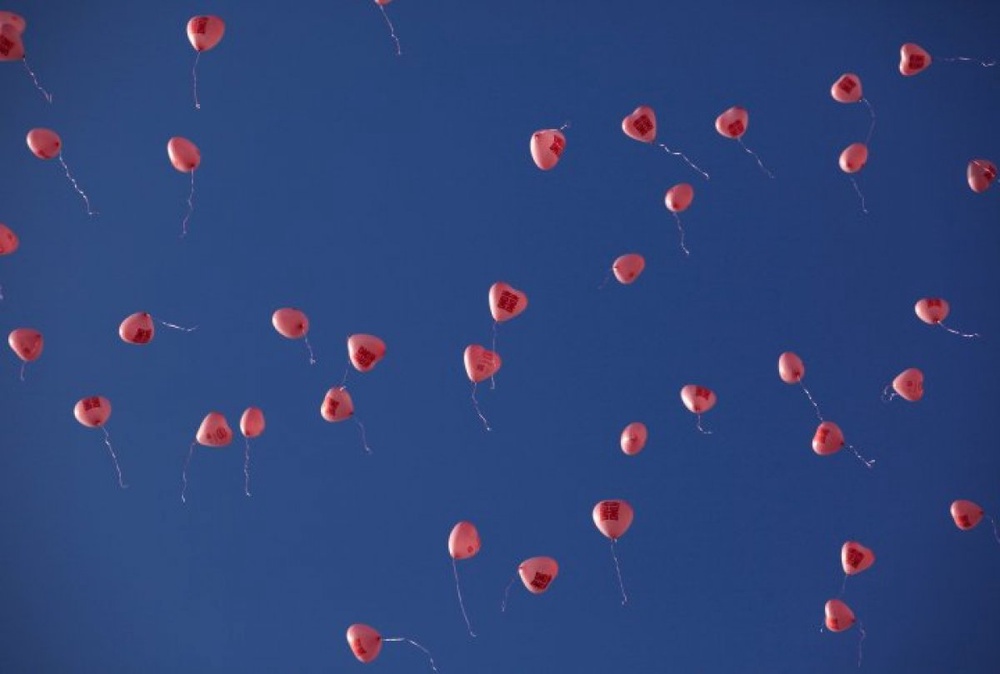 About 100 Newly-wed couples release heart-shaped balloons during their mass wedding ceremony on Valentines Day in Malaysia. ©Reuters