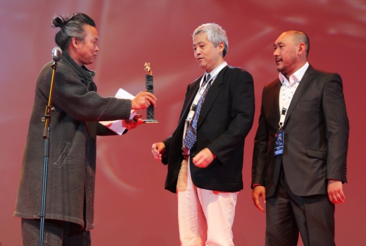 South-Korean movie-maker giving the main festival's award. <br>Photo by Aizhan Tugelbayeva©