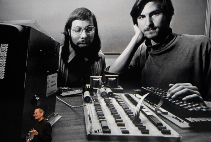 Steve Jobs stands beneath a photograph of him and Apple-co founder Steve Wozniak from the early days of Apple during the launch of Apple's new "iPad" tablet computing device in San Francisco, California, January 27, 2010. <br>©REUTERS/Kimberly White