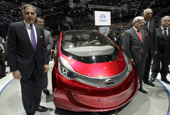 Chairman of Tata Motors Ratan Tata posing next to Tata Megapixel. ©REUTERS