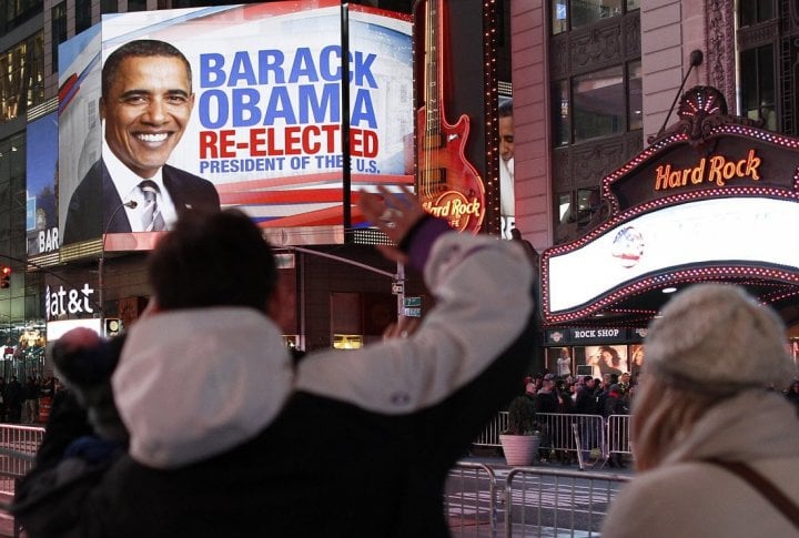 People celebrate in Times Square after Barack Obama was projected to win the U.S presidential election. ©REUTERS/Carlo Allegri 