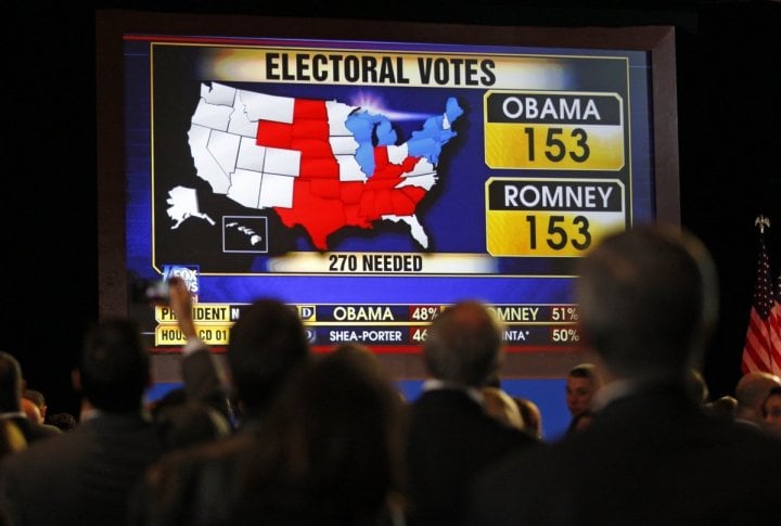 Supporters watch voting returns at the election night rally for U.S. Republican presidential nominee Mitt Romney in Boston. ©REUTERS/Jessica Rinaldi