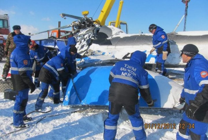 Emergency Situation Department's staff clearing the helicopter's fragments. Photo courtesy of press-service of Almaty oblast Emergency Situations Department©