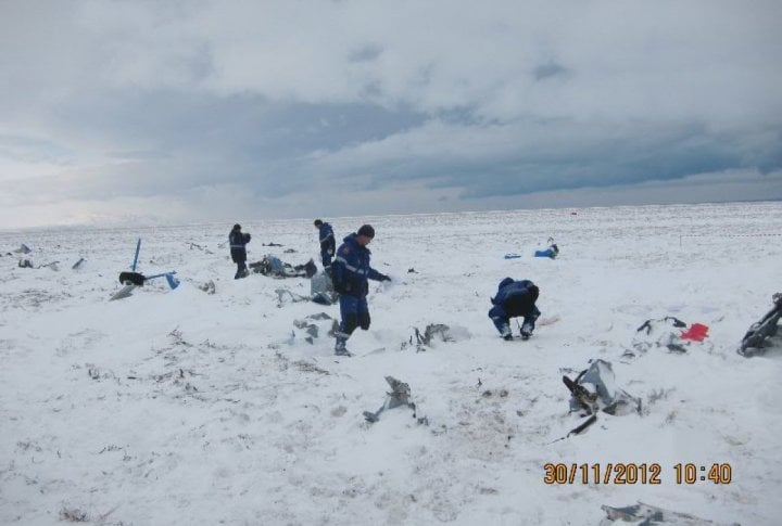 Emergency Situation Department's staff clearing the helicopter's fragments. Photo courtesy of press-service of Almaty oblast Emergency Situations Department©