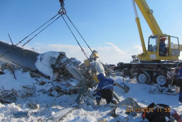 Emergency Situation Department's staff clearing the helicopter's fragments. Photo courtesy of press-service of Almaty oblast Emergency Situations Department©