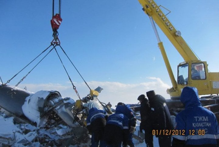 Emergency Situation Department's staff clearing the helicopter's fragments. Photo courtesy of press-service of Almaty oblast Emergency Situations Department©