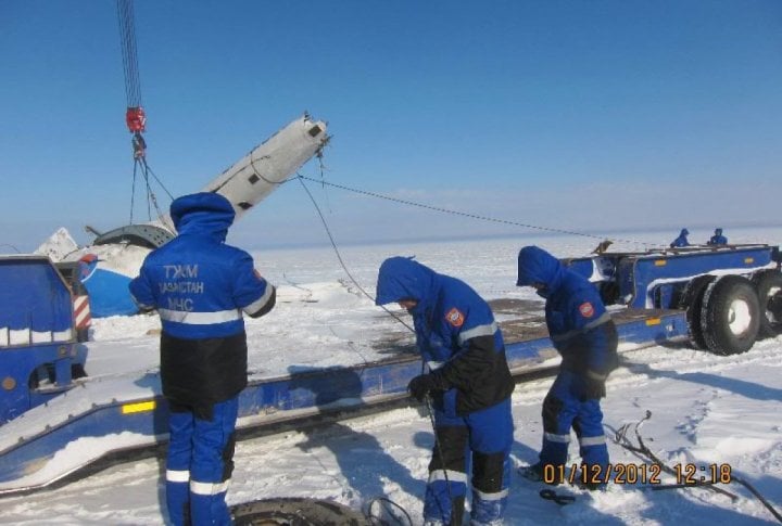 Emergency Situation Department's staff clearing the helicopter's fragments. Photo courtesy of press-service of Almaty oblast Emergency Situations Department©