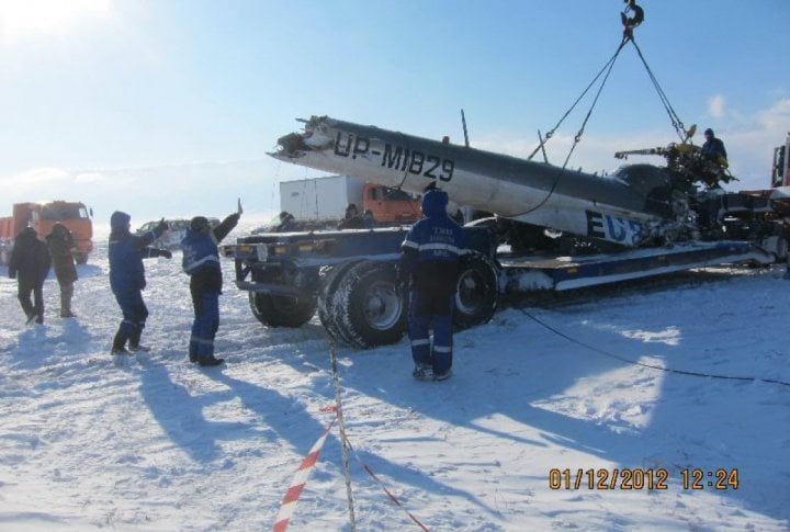 Emergency Situation Department's staff clearing the helicopter's fragments. Photo courtesy of press-service of Almaty oblast Emergency Situations Department©