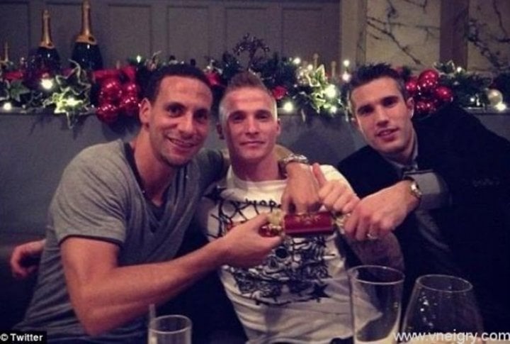 Footballers of Manchester United: Rio Ferdinand, Alexander Buttner and Robin van Persie 