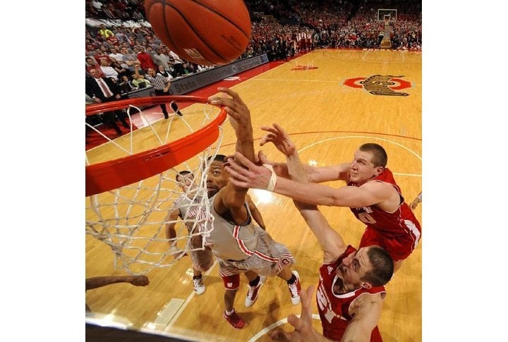 Lenzelle Smith, Jr. (32) battles for a rebound with Wisconsin's Jared Berggren (40) and Josh Gasser (21) in the Badgers' comeback win at the Buckeyes. Photo courtesy of SI.com