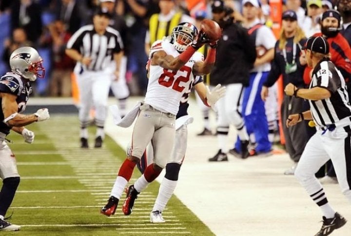 Mario Manningham hauls in a crucial fourth-quarter pass to set the Giants up for the winning score in the Super Bowl. Photo courtesy of SI.com