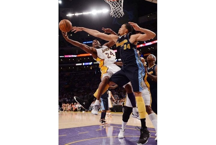 Kobe Bryant gets denied by Nuggets center JaVale McGee during a Denver-Los Angeles Staples Center showdown. Photo courtesy of SI.com