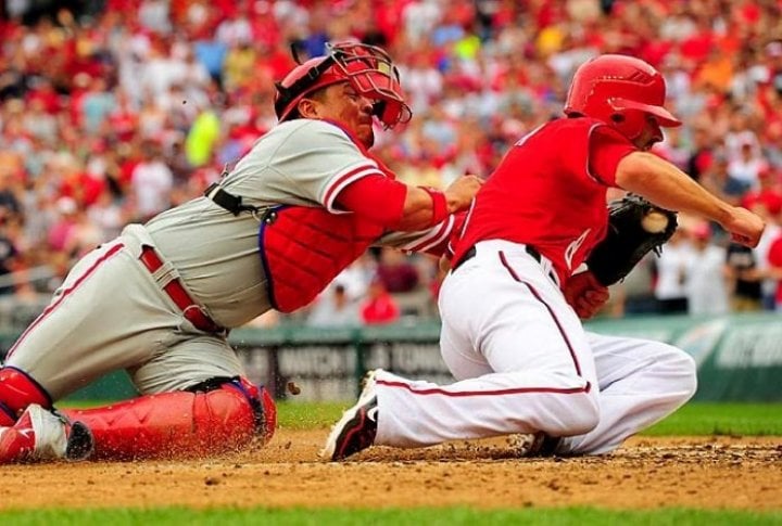 Philadelphia Phillies catcher Carlos Ruiz puts the tag on Washington Nationals second baseman Danny Espinoza. Photo courtesy of SI.com