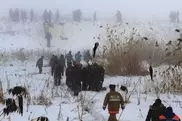 At CRJ-200 plane crash site near Almaty