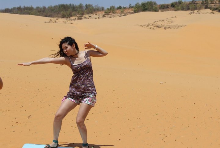 One can ride a board in the Sand Dunes. Photo by Roza Yessenkulova©