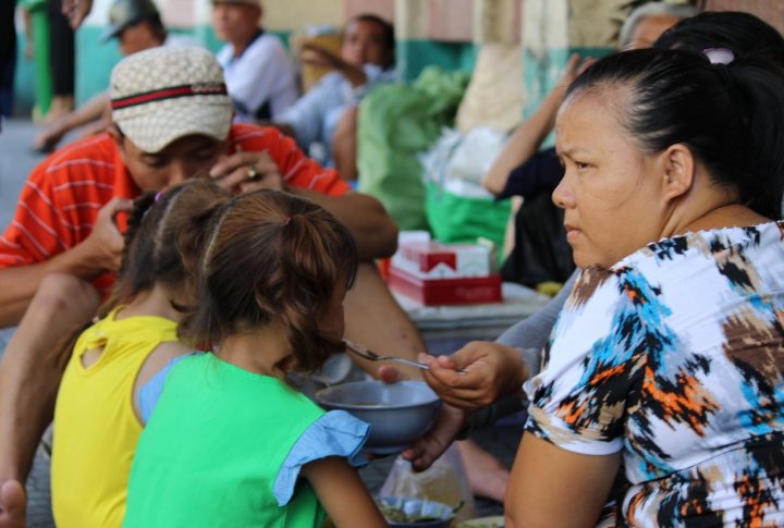 Local citizens eating at the streets can be seen at the markets and next to the shops. Photo by Roza Yessenkulova©