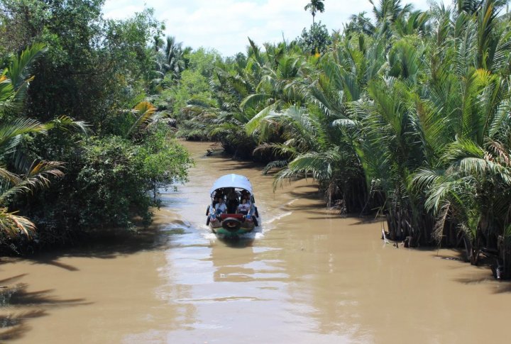 Cu Chi. The tourists can take a boat on the jungle river. Photo by Roza Yessenkulova©