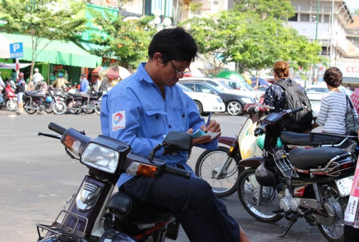 One can drive a motorbike without driver's license in Vietnam. The pedestrians are yielded the right-of-way. Photo by Roza Yessenkulova©