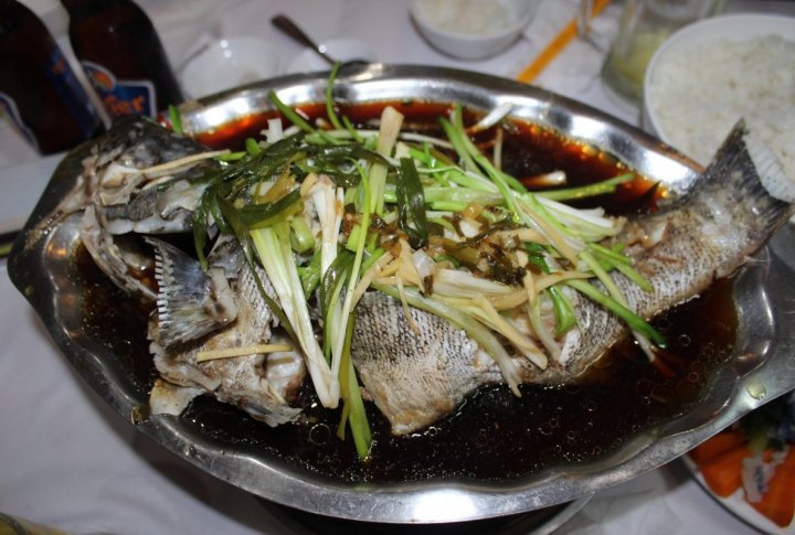 FIsh is served on a pan and made on open fire. It takes 15 minutes to cook it. Photo by Roza Yessenkulova©