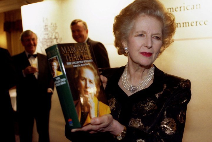 Baroness Thatcher poses with a copy of her new book at a launch attended by members of the British-American Chamber of Commerce November 25, 1997.  ©REUTERS