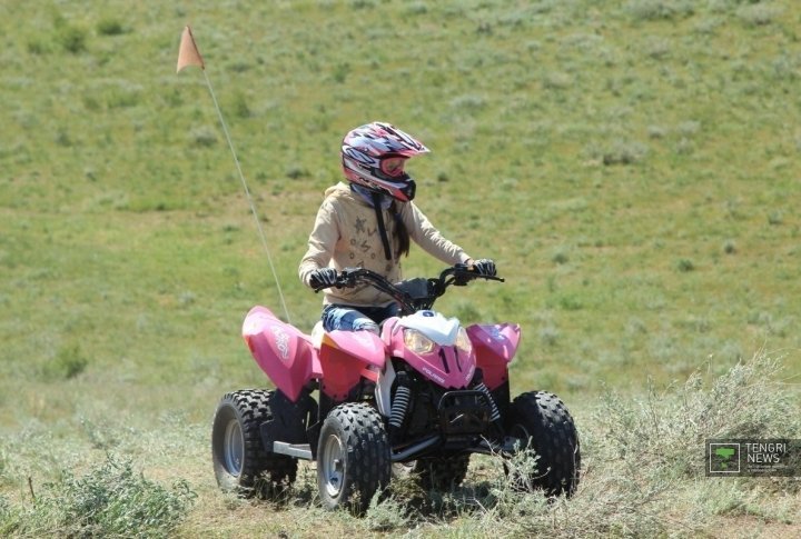 Ten bright and colored small bikes and quads started the race. Photo by Olga Kuchina©