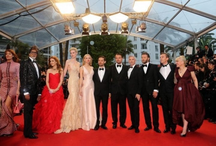 Director Baz Luhrmann (4thR) and cast members Leonardo DiCaprio (5thR), Carey Mulligan (5thL), Tobey Maguire (6thL), Joel Edgerton (3thR), Isla Fisher (3thL), Elizabeth Debicki (4thL), Amitabh Bachchan (2ndL) and Catherine Martin (R), production designer. ©REUTERS