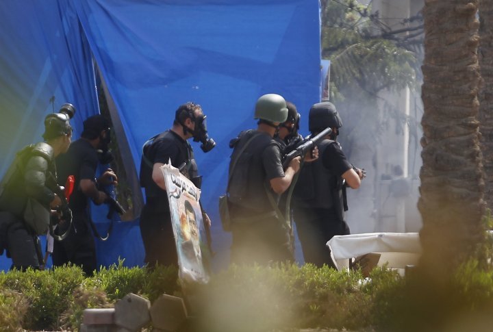 Riot police are seen during a clash with members of the Muslim Brotherhood and supporters of deposed Egyptian President Mohamed Mursi. ©REUTERS