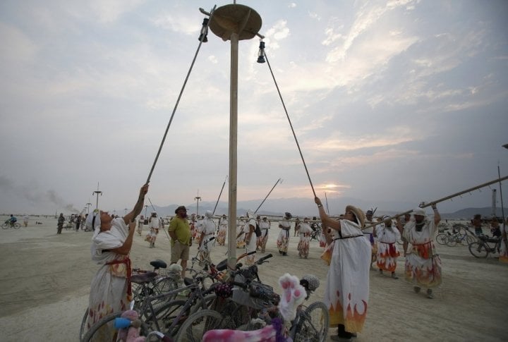 Lamplighters make their way across the Playa during the Burning Man 2013 arts and music festival. ©REUTERS