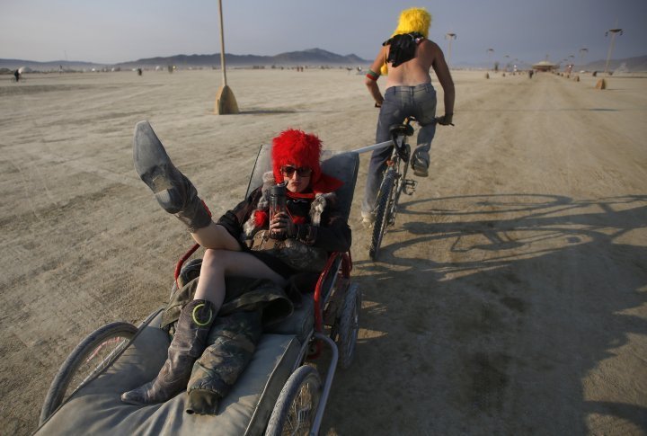 Christin Meador is towed along the Playa by Adam Johnson at sunrise.  ©REUTERS