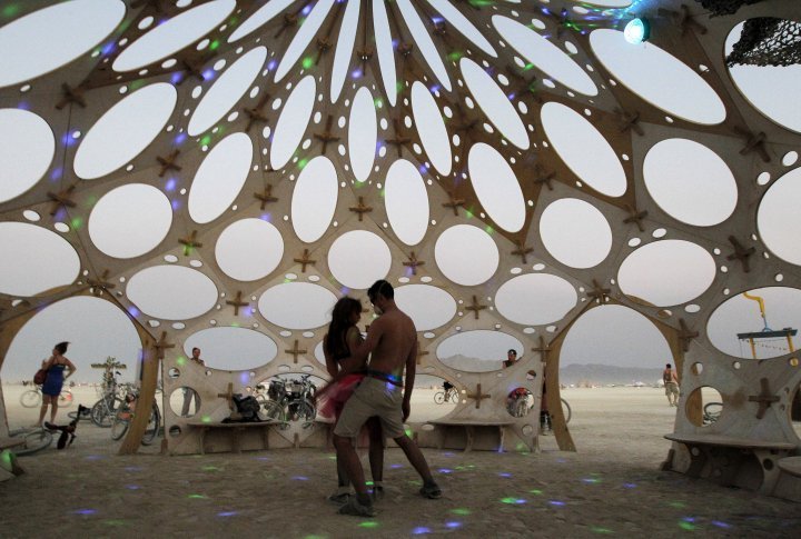 Participants dance in a dance dome during the "Gold Bikini Happy Hour" hosted by Rat Camp. ©REUTERS