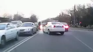 Автомобиль дорожной полиции едва не сбил пешехода в Алматы