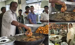 Индиец жарит рыбу в кипящем масле голыми руками