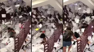 Школьники устроили грандиозный дождь из тетрадей и прокатились по ним