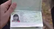 Zulfiya Chinshanlo shows her Kazakhstan passport