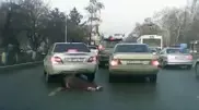 A woman dragged under car in Almaty