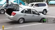 Car stuck in hole in Almaty center
