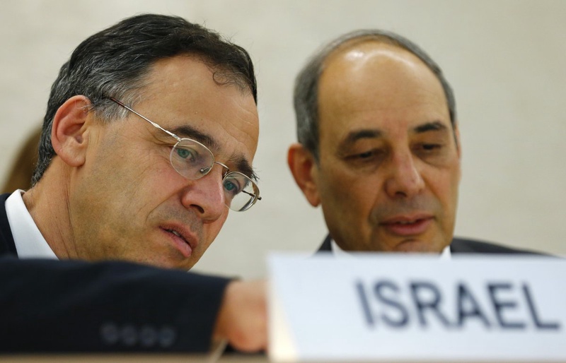 Shai Nitzan (L) Deputy Attorney General Ministry of Justice of Israel waits with Eviatar Manor, Israel Ambassador to the U.N. ©Reuters/Denis Balibouse 