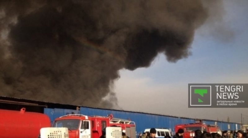 Smoke issuing from the fire at Almaty flea market. © Vladimir Prokopenko