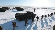 Military vehicles march near Almaty
