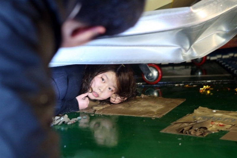 A South Korean resident lies beneath debris at the scene of a collapsed building at the Mauna Resort in Gyeongju. 