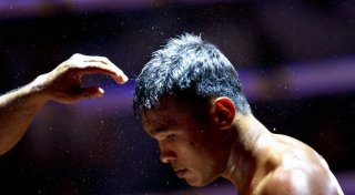 Lethwei martial arts exponent Tun Tun Min listening to his trainer before his bout against his competitor , US national Cyrus "Black Dynamite" Washington, at the Thein Phyu boxing stadium in Yangon. ©