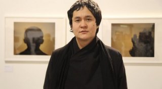 Film Director Emir Baigazin at his Photo Exhibition in Lugano. Photo courtesy of Emir Baigazin