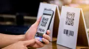 When will Kazakhstan introduce a unified QR code for all banks?