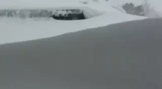 ШҚО-да аудан орталығының үйлерін шатырына дейін қар басты