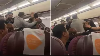 Ұшақ ішінде төбелескен ер адамдардың видеосы Желіде жылдам таралып кетті